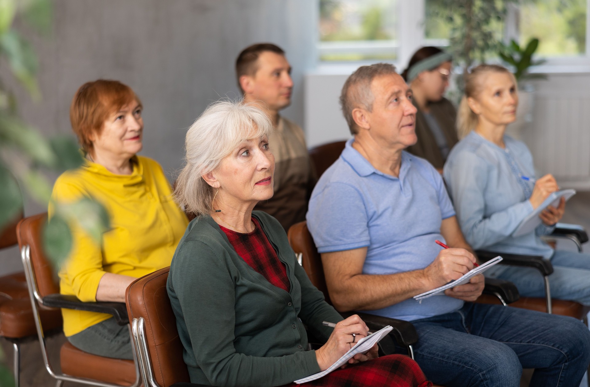 Adult students listening in classroom university